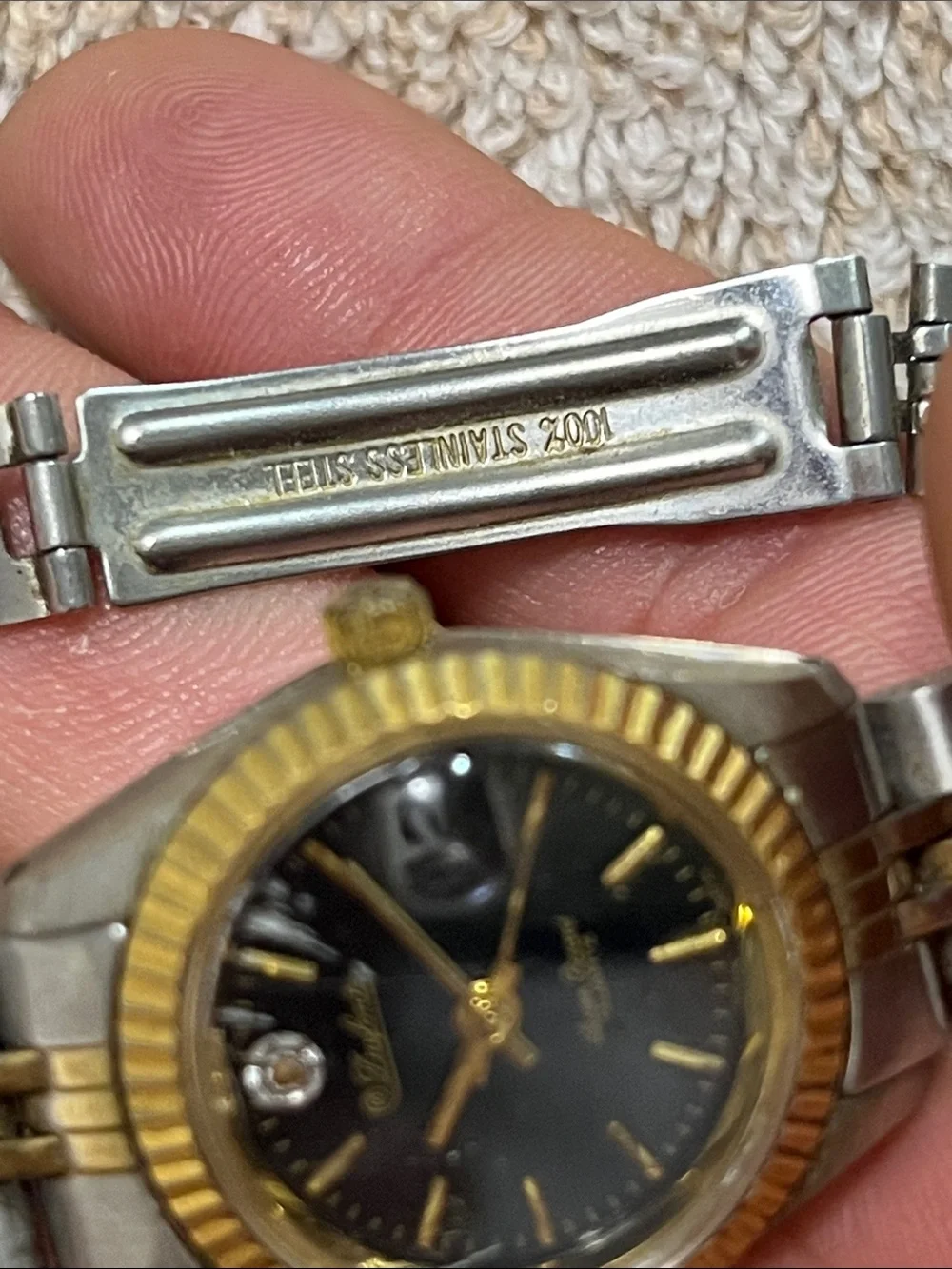 Two-Tone Women's Dress Watch with Black Dial and Gold Accents